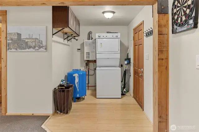 Main floor laundry, mechanical area, with access to the covered back area to bring wood inside during the winter!