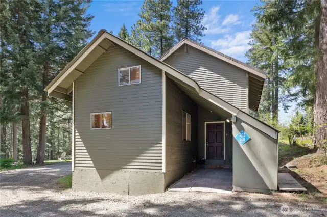 Small attached carport is  a nice spot for your side by side or snowmobile. This is also the covered   convenient storage for your fireplace wood!