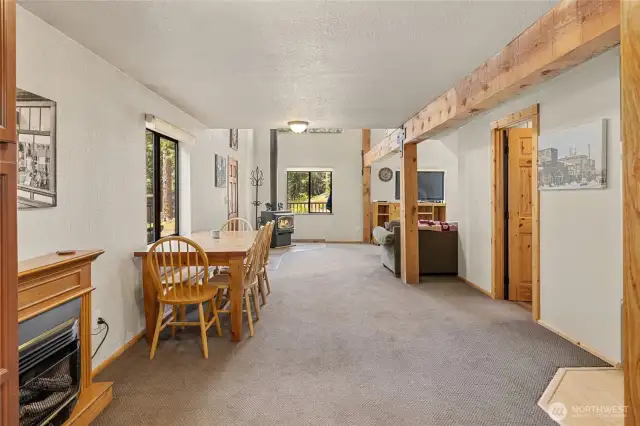 Space between living room & kitchen is a flex space for dining, reading nook, or whatever makes you happy! It has a propane fireplace for extra coziness.