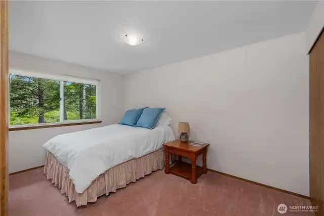 Bedroom looks to the water