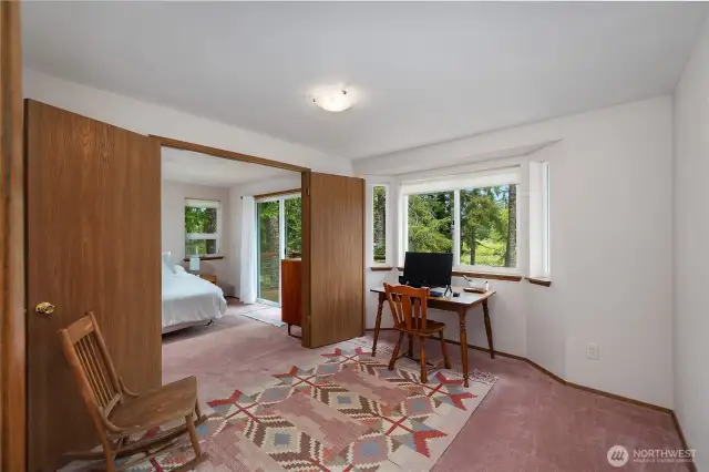 Primary ensuite with french doors that open to this office space.