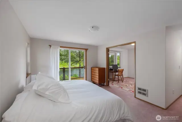 Primary bedroom spacious and open with a lake view!