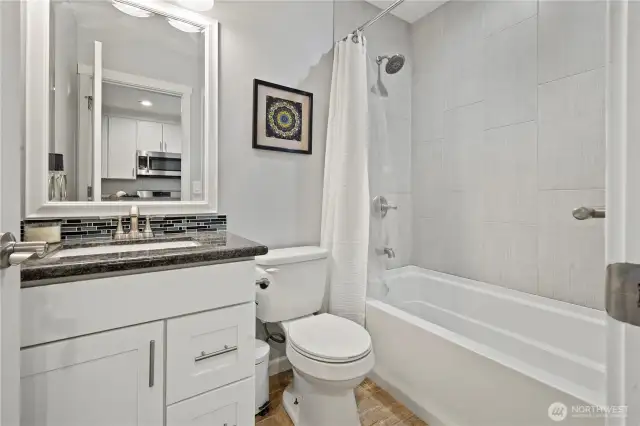 Newer full bath Quartz counters and tile floors