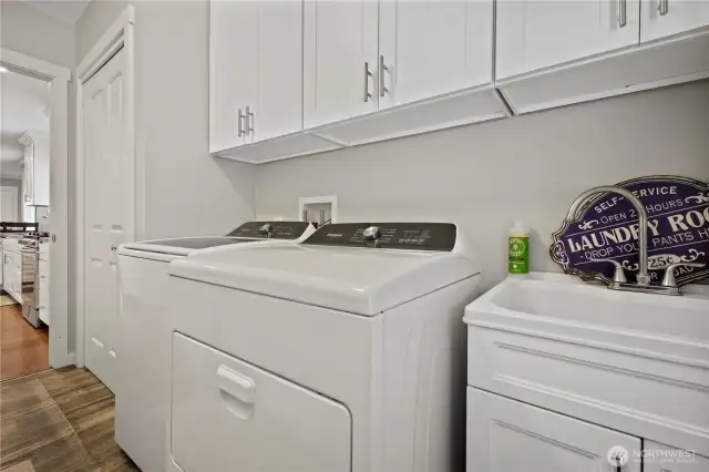 Laundry room with sink washer and dryer are included