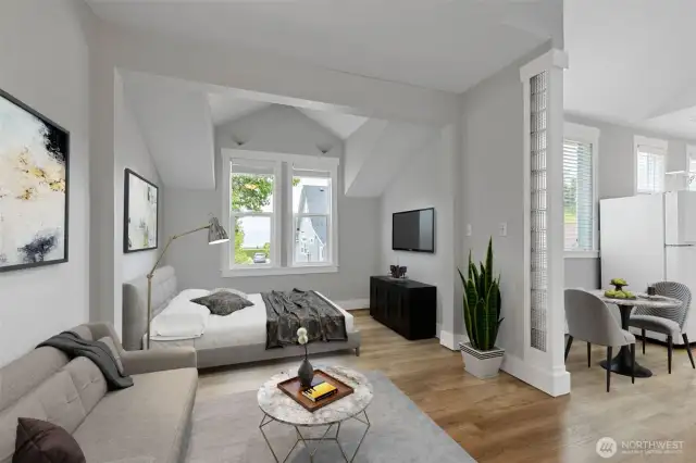 Open living and bedroom area in ADU. Photo Virtually Staged