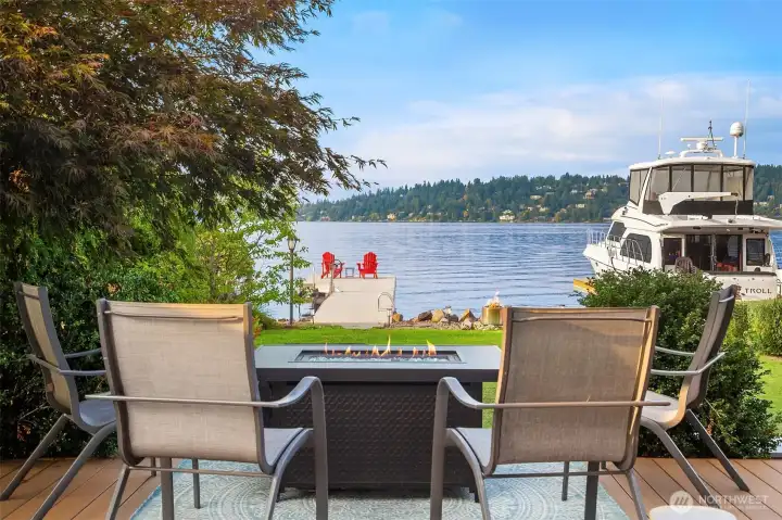 The deck overlooks the level yard to the lake