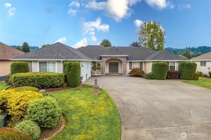 Immaculate front yard landscaping with sprinkler system.