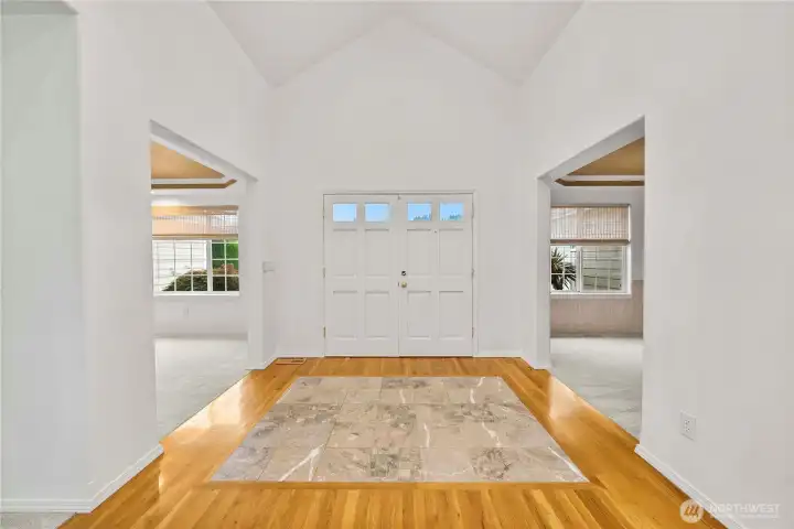 Formal Entry with hardwood floors and Marble inset.