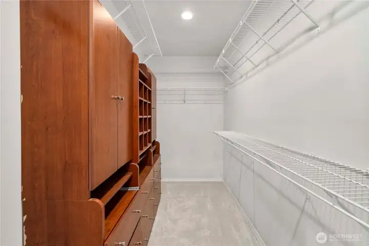 Primary Bedroom walk-in closet with Built-in organizer.