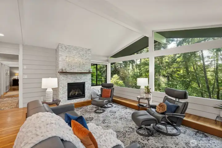 Wall-to-wall windows flooding the living room with natural light