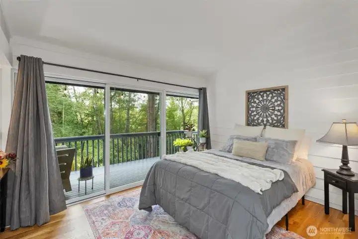 Comfortable second bedroom located on mainfloor with garden deck access