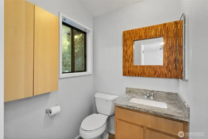 Functional half-bath attached to the upper level bedroom