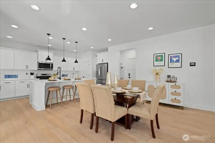 Perfectly Positioned Dining Space Between Kitchen and Living Room