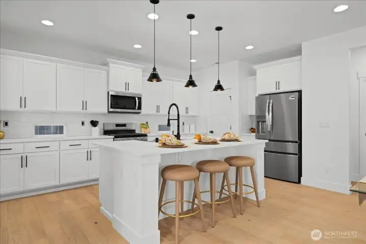 Gourmet Kitchen Featuring 7-Foot Island & Walk-In Pantry with Custom Shelving