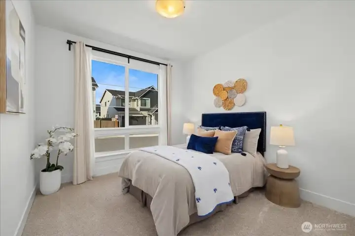 Oversized Windows Illuminate the Convenient Main-Floor Bedroom