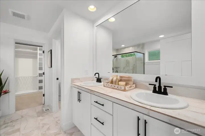 Spacious Ensuite Featuring Double Vanities and Elegant Marble Tile Flooring, Plus Floor To Ceiling Shower Surround