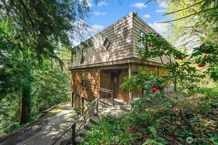 Rare and beautifully transformed home perched within a serene setting with unmatched privacy and natural beauty.