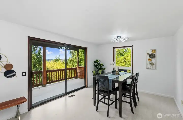Light-filled dining room with access to the expansive Gekco deck!