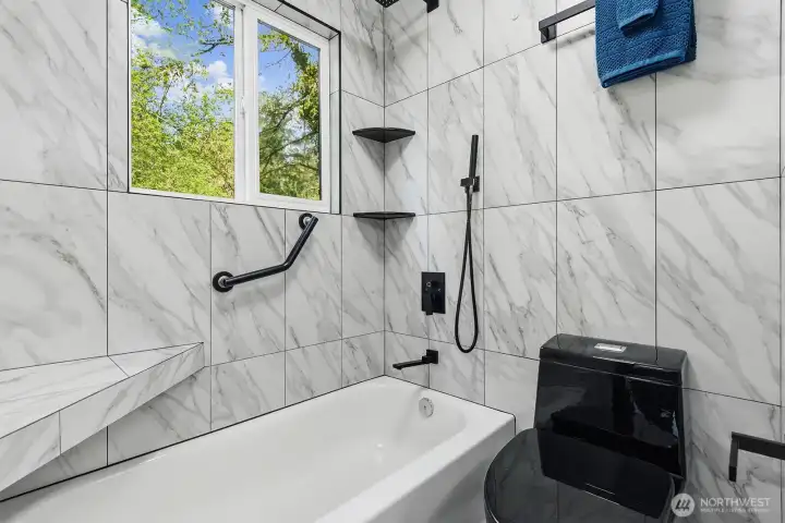 Relax in this beautifully remodeled primary bathroom
