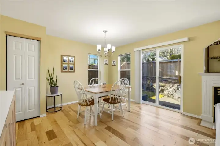 Dining area with sliding glass door to backyard.