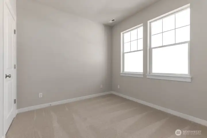 Main floor bedroom/office had a closet and large windows to let in lots of light.  Colors and finishes may vary.