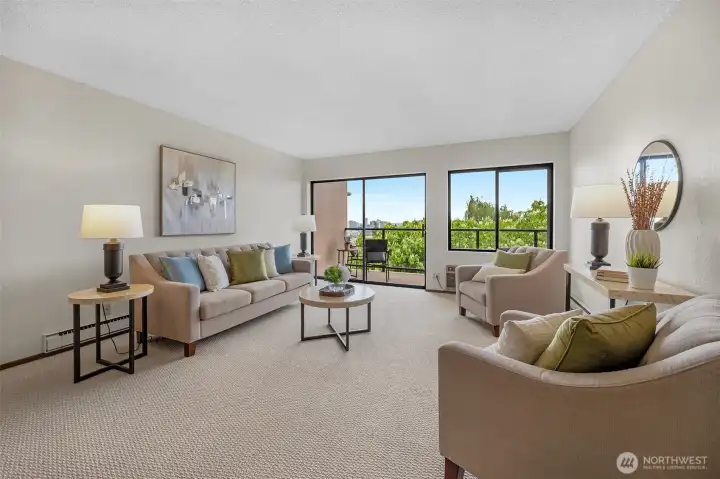 Generously sized living room, refreshed with new paint and carpet.