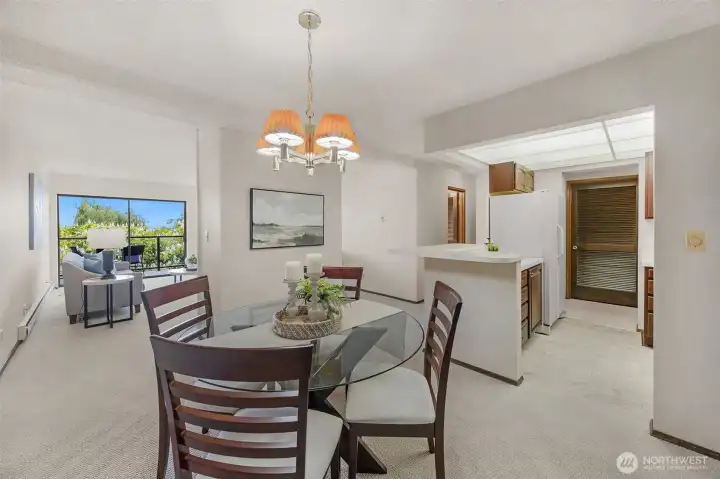 Share meals and moments in a dining room that opens to both kitchen and living spaces.
