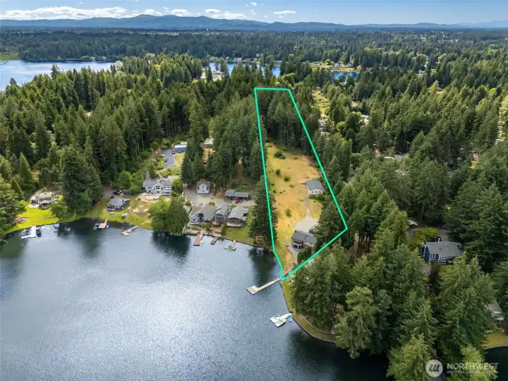 Some properties give you a backyard. This one gives you 4.584 acres, two parcels and an entire vision board of possibilities. This aerial outlines the full property boundaries, showing how the waterfront parcel connects to the additional 3.7-acre parcel beyond. Whether you're dreaming of a multigenerational retreat, extra recreational space, future improvements or simply enjoying the privacy that comes with owning this much land, the setup is packed with potential. Convenient access from Holmes Island Road combines with a second access point via the gated shared driveway off Carpenter Road, making the larger parcel surprisingly easy to utilize. As if that weren't enough, you're positioned in one of Thurston County's favorite lake corridors with Long Lake, Hicks Lake and Pattison Lake all within minutes of one another. For water lovers, it's about as close as you can get to hitting the freshwater jackpot. Some properties give you a backyard. This one gives you 4.584 acres, two parcels and an entire vision board of possibilities. This aerial outlines the full property boundaries, showing how the waterfront parcel connects to the additional 3.7-acre parcel beyond. Whether you're dreaming of a multigenerational retreat, extra recreational space, future improvements or simply enjoying the privacy that comes with owning this much land, the setup is packed with potential. Convenient access from Holmes Island Road combines with a second access point via the gated shared driveway off Carpenter Road, making the larger parcel surprisingly easy to utilize. As if that weren't enough, you're positioned in one of Thurston County's favorite lake corridors with Long Lake, Hicks Lake and Pattison Lake all within minutes of one another. For water lovers, it's about as close as you can get to hitting the freshwater jackpot.