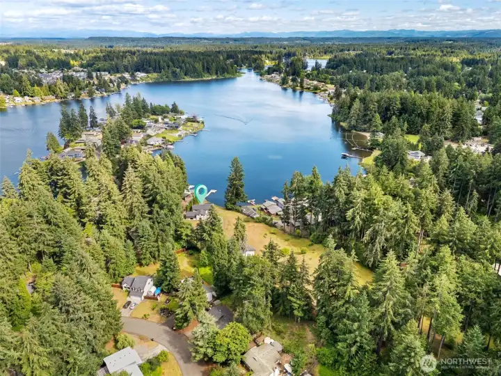 The view says vacation. The location says convenience. This aerial showcases the incredible combination of lake, forest and open space surrounding the property while reminding you just how connected you remain to everyday amenities. Within roughly 10 minutes, you can be shopping, dining, grabbing coffee or hopping onto I-5 for an easy commute. Downtown Olympia's waterfront events, local restaurants, galleries and thriving arts community are only about 15 minutes away, giving you the best of both worlds. Long Lake is beloved for its year-round recreation opportunities, whether your idea of a perfect afternoon involves fishing for bass and trout, cruising the shoreline by kayak, pulling the kids on a tube, water skiing or spending the day on a jet ski. The view says vacation. The location says convenience. This aerial showcases the incredible combination of lake, forest and open space surrounding the property while reminding you just how connected you remain to everyday amenities. Within roughly 10 minutes, you can be shopping, dining, grabbing coffee or hopping onto I-5 for an easy commute. Downtown Olympia's waterfront events, local restaurants, galleries and thriving arts community are only about 15 minutes away, giving you the best of both worlds. Long Lake is beloved for its year-round recreation opportunities, whether your idea of a perfect afternoon involves fishing for bass and trout, cruising the shoreline by kayak, pulling the kids on a tube, water skiing or spending the day on a jet ski.