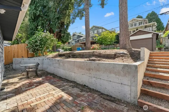 Quaint paved shared backyard with steps to alley and 2-alley parking spaces... Quaint paved shared backyard with steps to alley and 2-alley parking spaces...