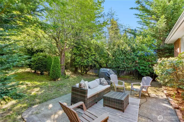 Luscious backyard with mature landscaping.