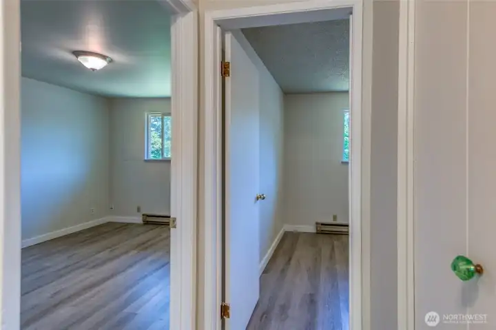 Hallway looking towards two bedrooms. Hallway looking towards two bedrooms.