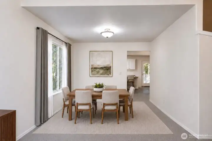 Virtually staged. Dining room is conveniently located just off the kitchen for easy gatherings. Virtually staged. Dining room is conveniently located just off the kitchen for easy gatherings.