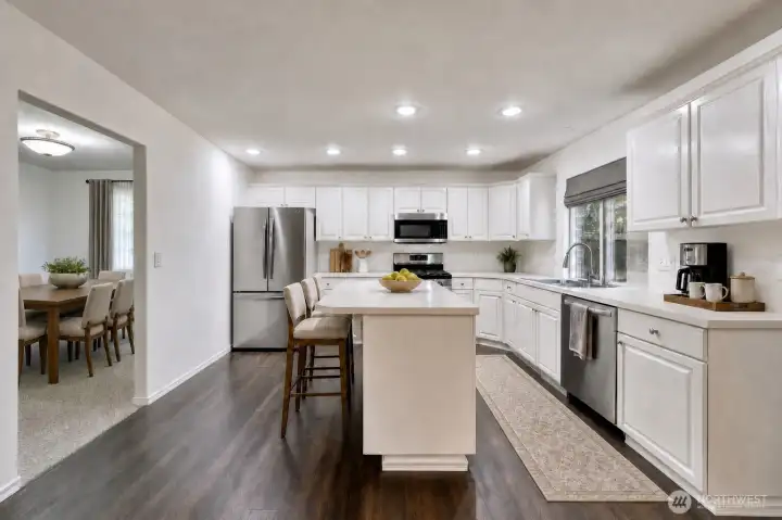 Virtually staged. Kitchen with large island and lots of cabinets is great for entertaining. Virtually staged. Kitchen with large island and lots of cabinets is great for entertaining.