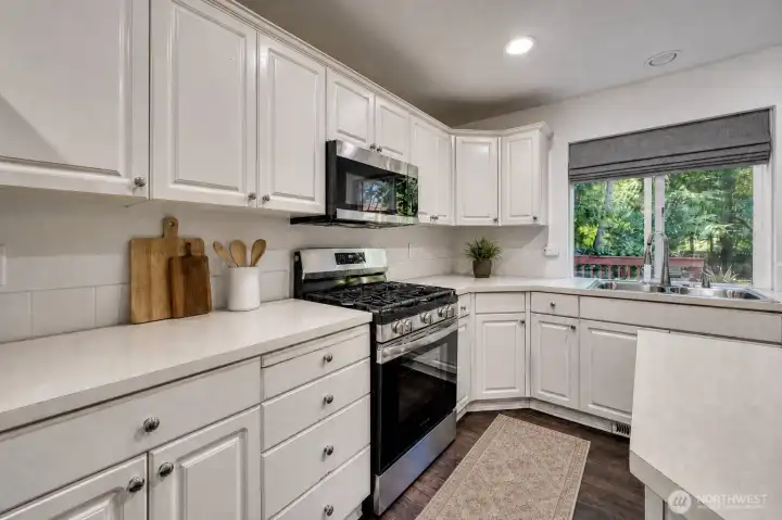 Lots of cabinets and counter tops and a new gas range make this kitchen a breeze to cook in. Lots of cabinets and counter tops and a new gas range make this kitchen a breeze to cook in.