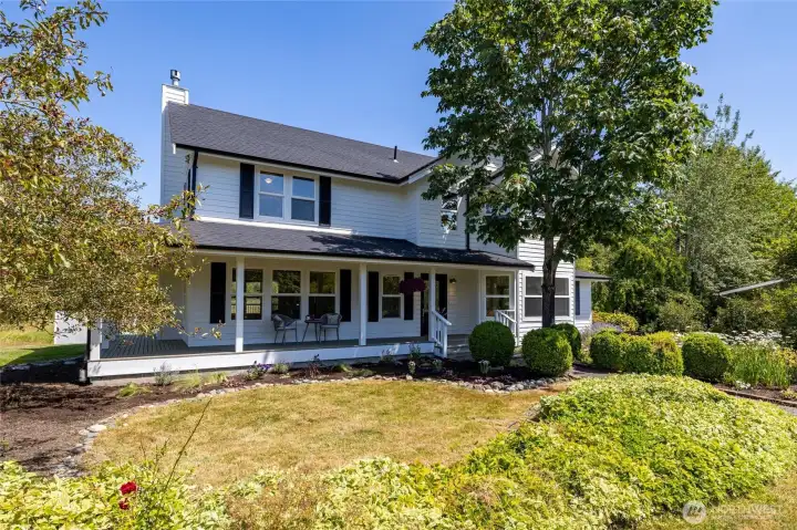 This gorgeous and large farmhouse features a wrap around porch This gorgeous and large farmhouse features a wrap around porch