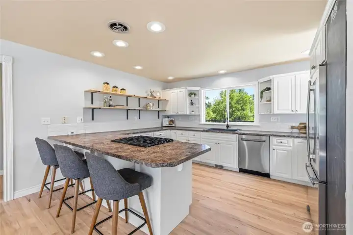 A large and open kitchen sits on the other side of the entry A large and open kitchen sits on the other side of the entry