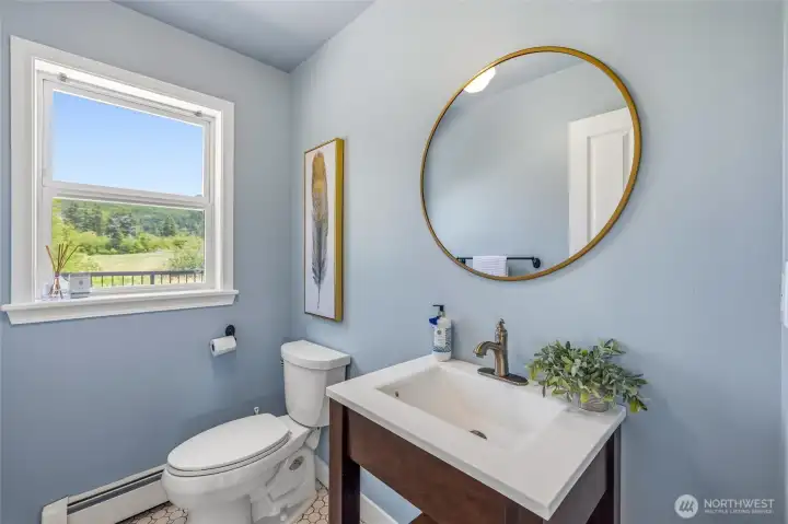 The main floor also features a convenient half bath. The main floor also features a convenient half bath.