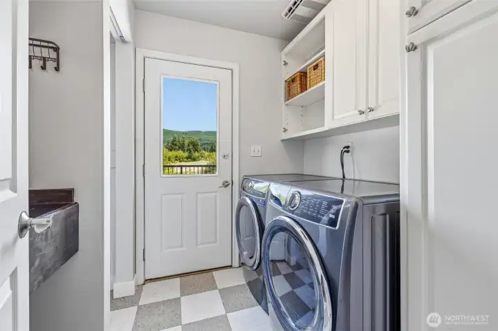 The laundry room with sink is also on the main floor with direct access to the back deck. The laundry room with sink is also on the main floor with direct access to the back deck.