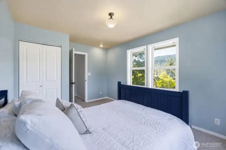 The blue bedroom overlooks the front of the home. The blue bedroom overlooks the front of the home.