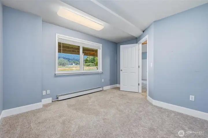 Downstairs in the lower level, you'll find the 5th bedroom. Downstairs in the lower level, you'll find the 5th bedroom.