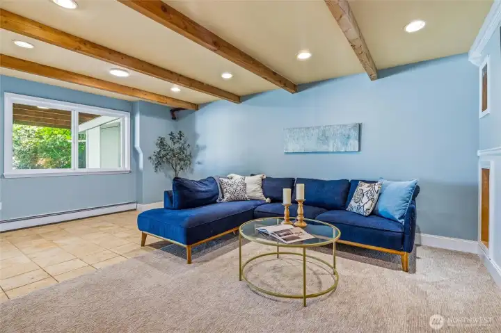 A large rec room/bonus room is situated downstairs with plenty of space to gather and relax. A large rec room/bonus room is situated downstairs with plenty of space to gather and relax.