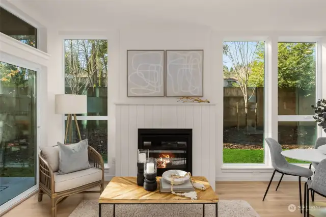 Relax by the fire in this thoughtfully designed living space. This area is minimalist yet inviting for unwinding or hosting intimate gatherings.