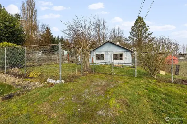 The property is fully fenced, one of two gates.