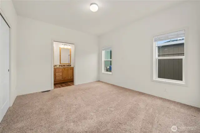 Primary Bedroom: Spacious primary suite with ensuite bath and large closet.