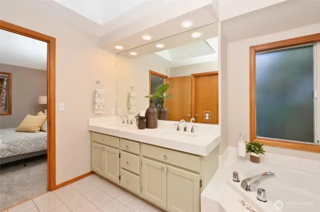 and a frosted window by the soaking tub for maximum natural light,