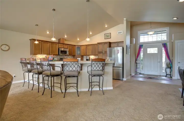 Kitchen peninsula offers a lot of seating space.