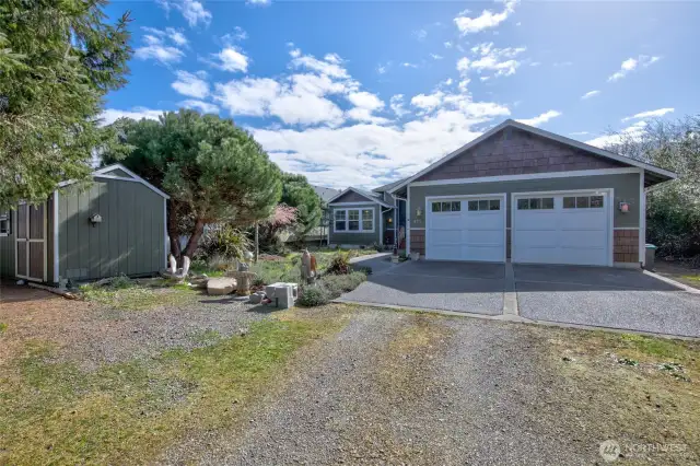 Out front is a storage shed, plenty of parking, and a small front yard.