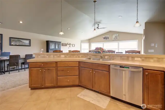 Kitchen peninsula overlooks dining and living area.