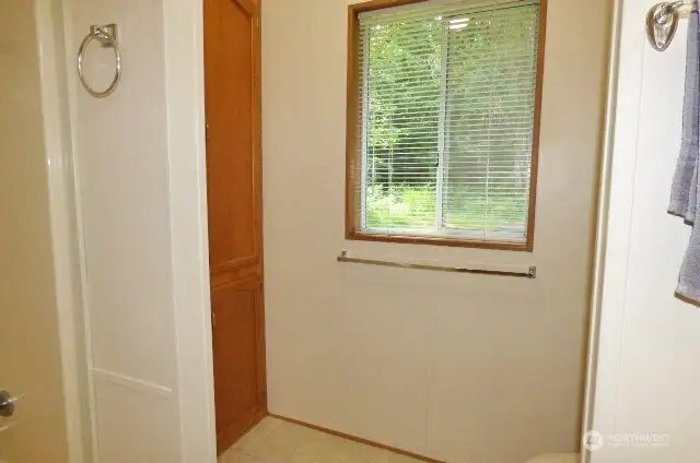 And yet another view of the primary bathroom with another linen closet.